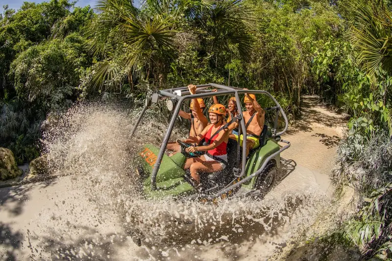 Zip-liner gliding over the jungle canopy at Xplor eco-park on an adventure tour from Playa del Carmen, Mexico