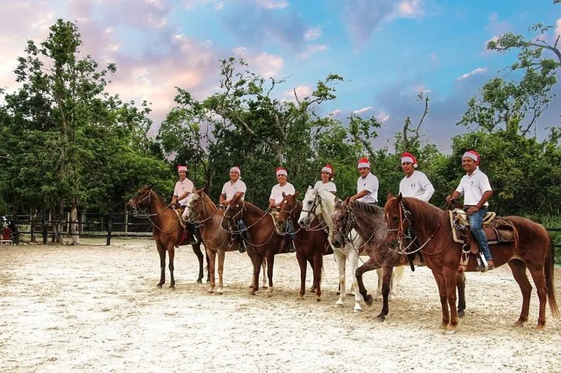 Guide and riders on horseback at the ranch before a horseback and cenote tour near Playa del Carmen, Mexico